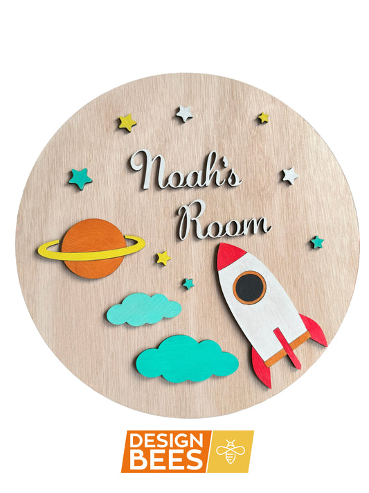 Nursery wall decoration featuring a cute rocket, saturn, stars and clouds